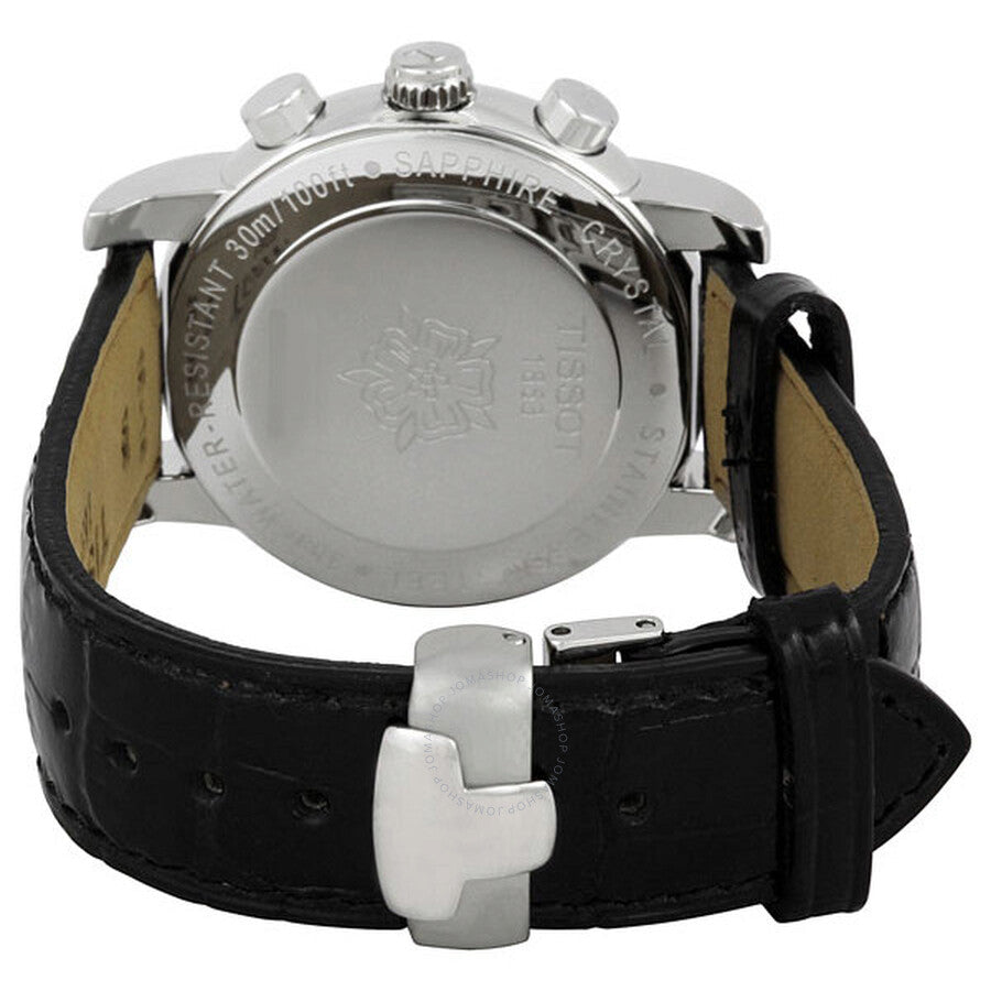 Caseback of Tissot watch showing engraved steel back and black leather strap with clasp