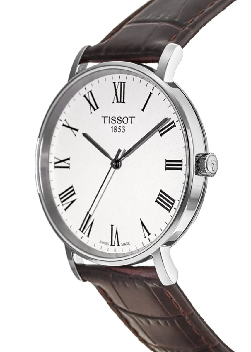 Tissot Everytime Medium angled view showing stainless steel case and brown crocodile leather strap