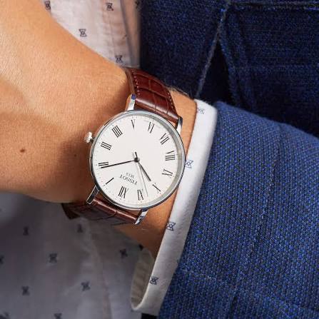 Tissot Everytime Medium worn on wrist with brown leather strap