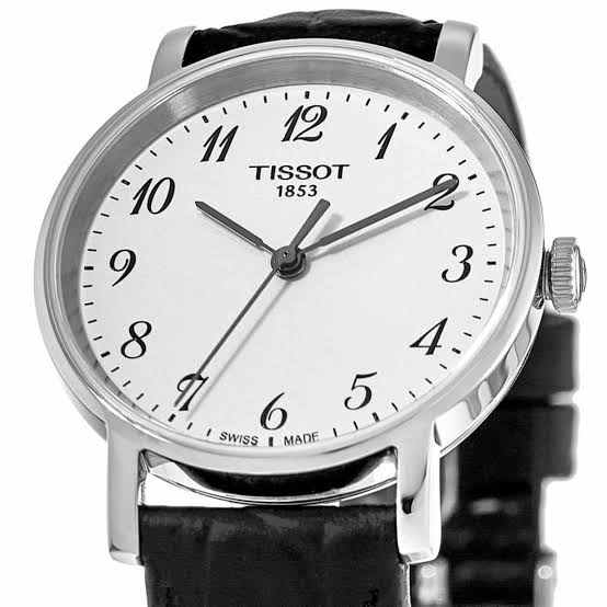 Close-up of Tissot Everytime white dial with Arabic numerals and Tissot 1853 branding
