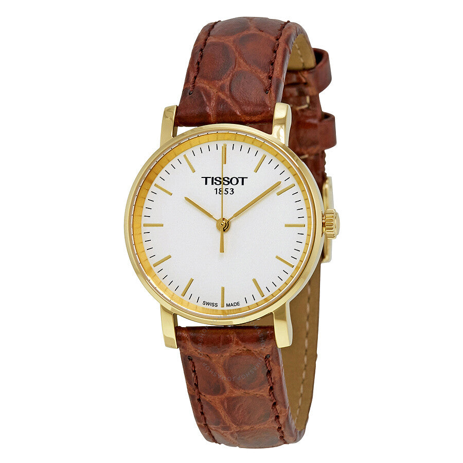 Tissot Everytime ladies watch with white dial, gold case, and brown crocodile leather strap