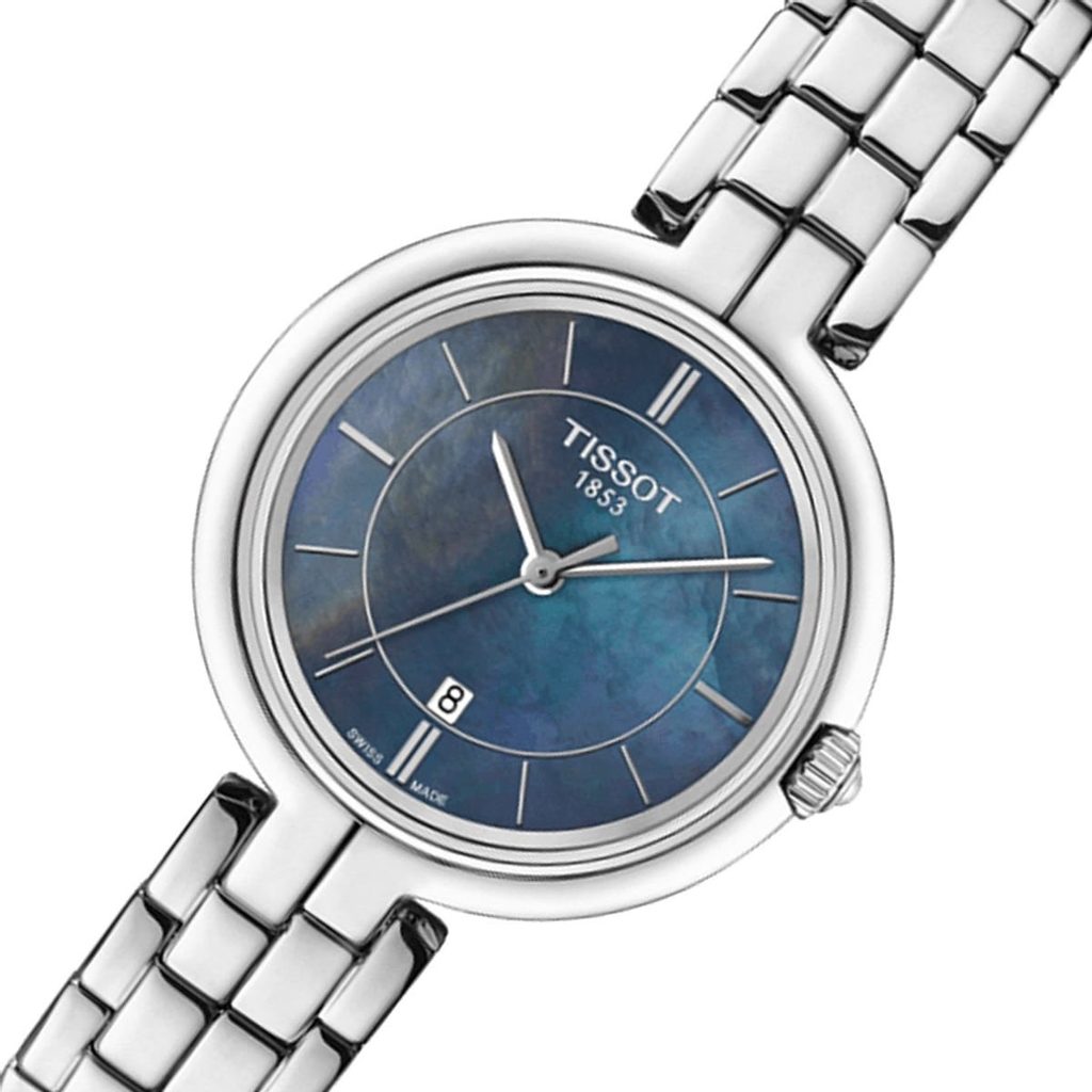 Tissot Flamingo watch at angle showing mother of pearl dial and metal bracelet detail