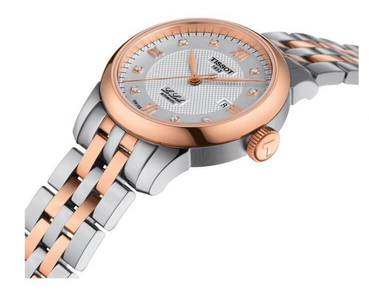 Tissot Le Locle watch three-quarter view with rose gold crown and mixed metal bracelet