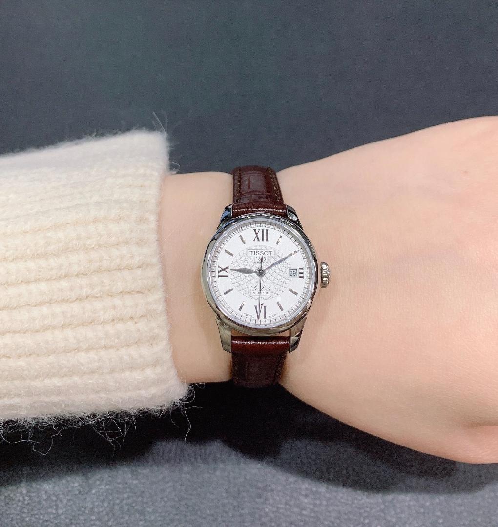 Tissot Le Locle ladies automatic watch on wrist displaying silver dial and Roman numerals