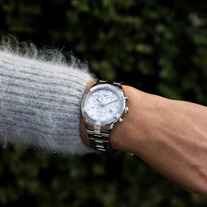 Tissot PR 100 Sport Chic Chronograph on wrist with stainless steel bracelet and white dial