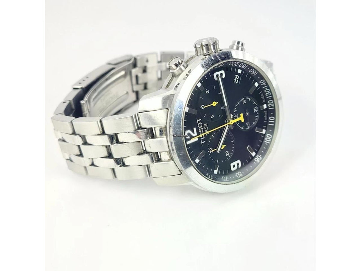 Tissot PRC200 chronograph watch displayed on wrist, showing dial and integrated stainless steel bracelet