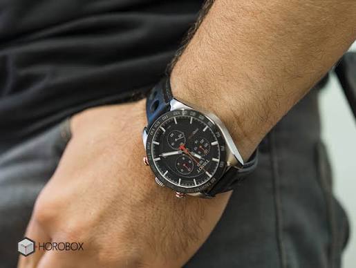 Tissot PRS 516 chronograph watch worn on wrist showing black dial and leather strap