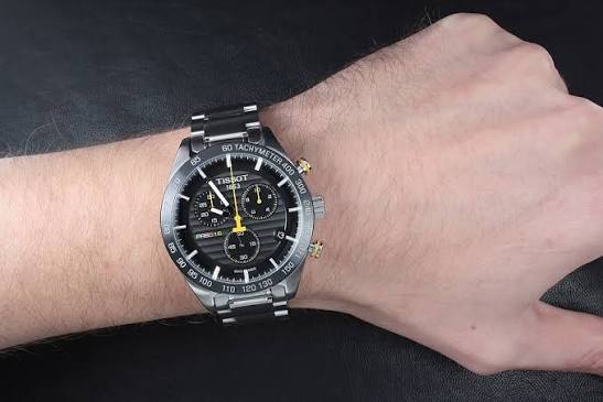 Tissot PRS 516 Chronograph worn on wrist with black dial and yellow accents