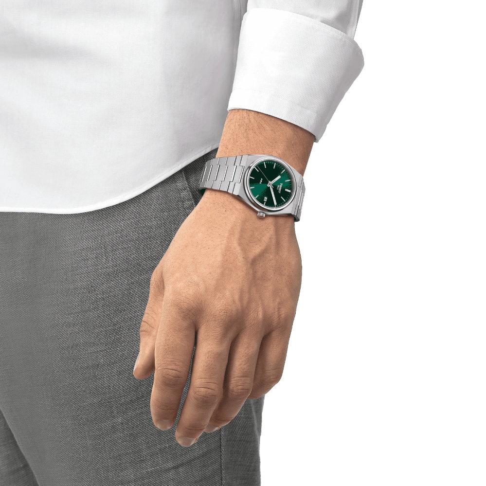 Tissot PRX quartz watch worn on wrist with green dial