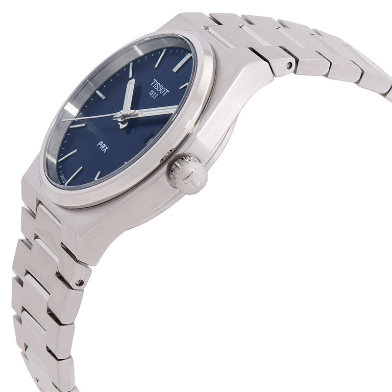 Tissot PRX watch angled view showing blue dial, steel bracelet, and crown detail