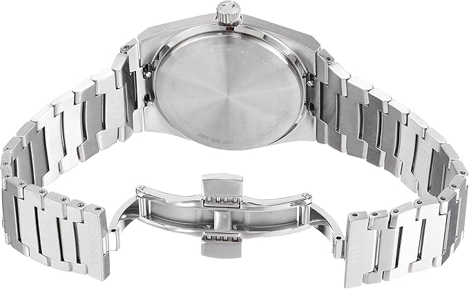 Tissot PRX watch caseback showing stainless steel back with logo and mineral crystal