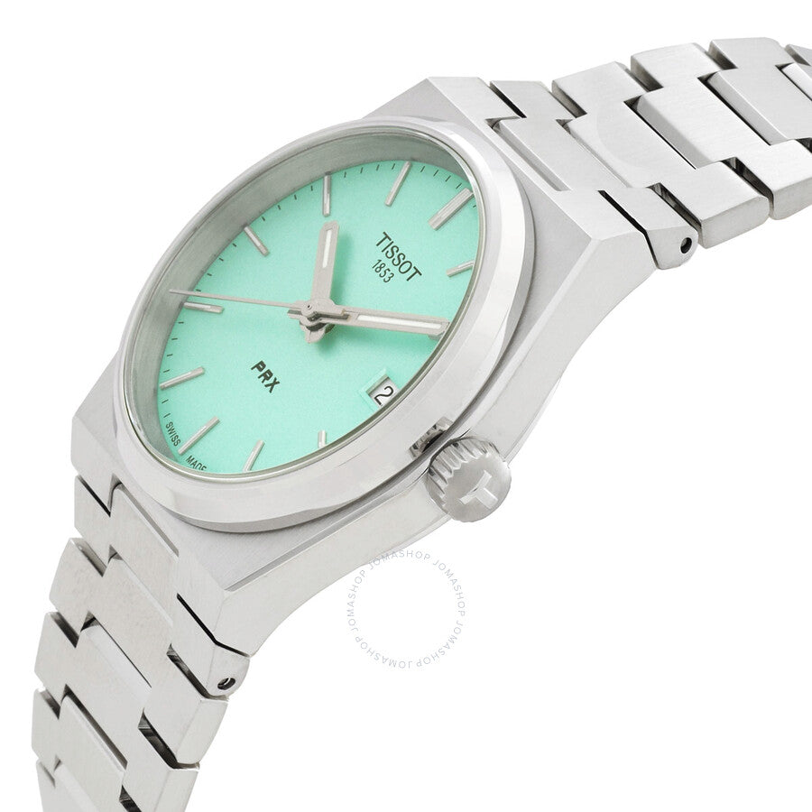 Tissot PRX light green dial watch displayed at three-quarter angle with stainless steel bracelet visible