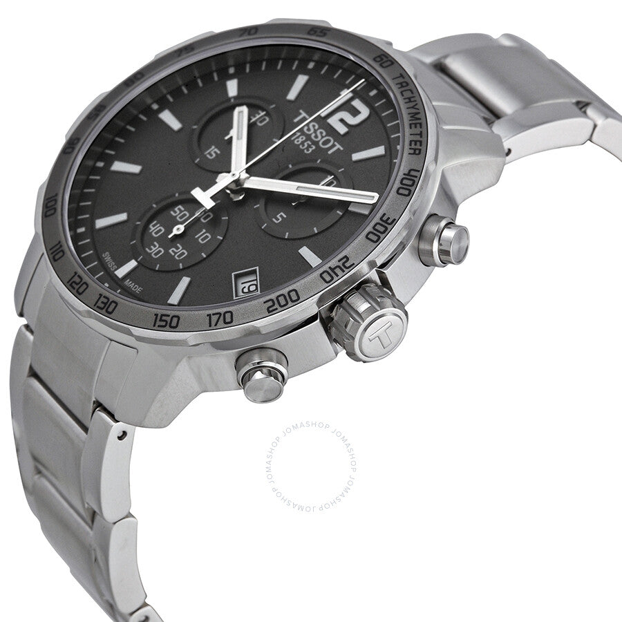 Tissot Quickster Chronograph angled view showcasing the anthracite dial, chronograph pushers, and stainless steel bracelet