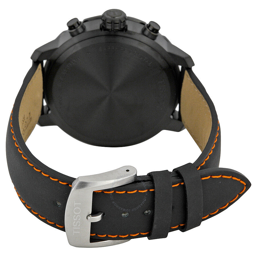 Tissot Quickster caseback view displaying black leather strap with orange stitching and Tissot buckle