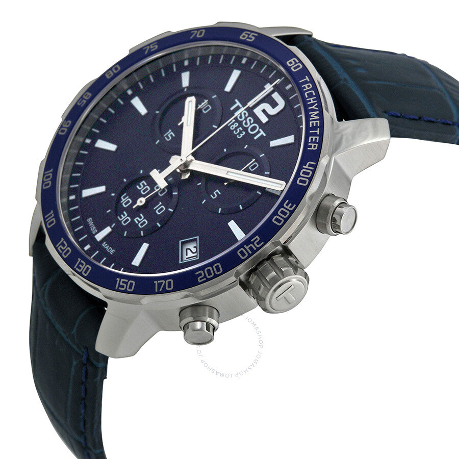 Tissot Quickster Chronograph angled view showing blue bezel, chronograph pushers, and black leather strap