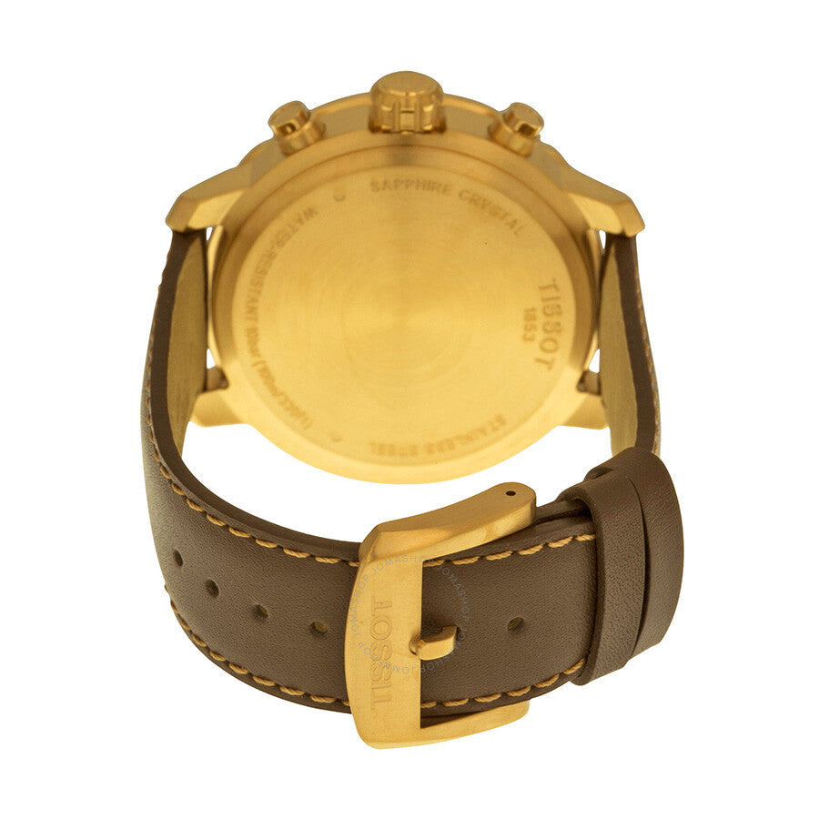 Tissot Quickster Chronograph gold caseback with brown leather strap visible