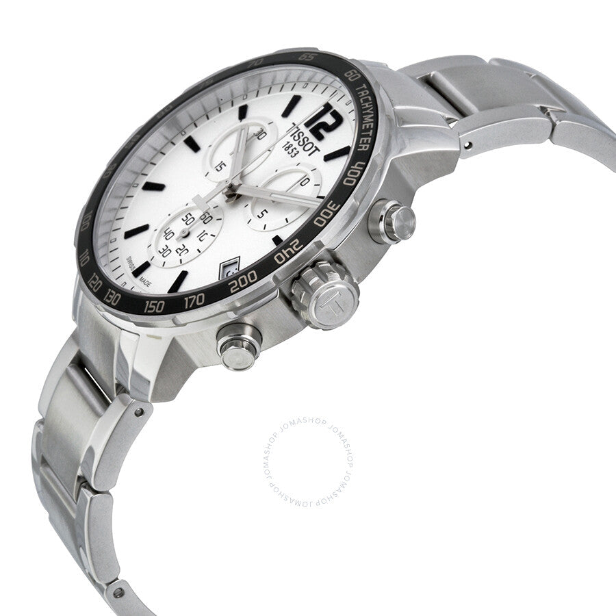Tissot Quickster Chronograph angled view showing silver dial, tachymeter bezel, and stainless steel strap
