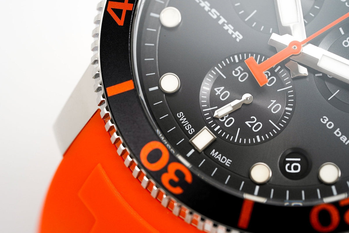 Close-up detail of Seastar 1000 chronograph dial with orange accents and subdials