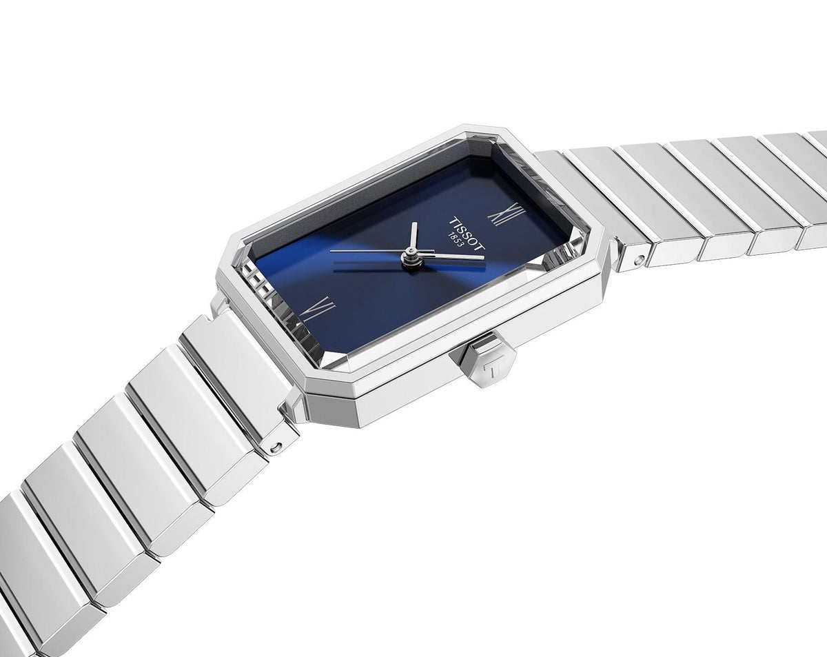 Angled view of Tissot SRV women's watch on wrist with stainless steel bracelet