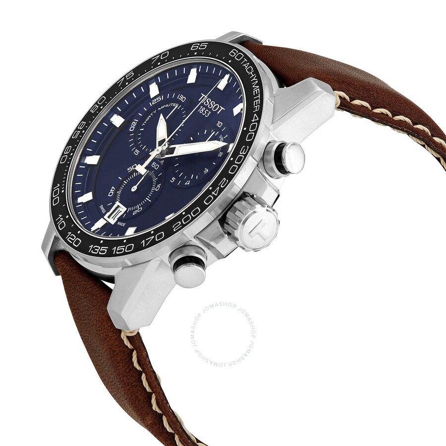 Tissot Supersport chronograph watch angled view showing blue dial, tachymeter bezel, and brown strap