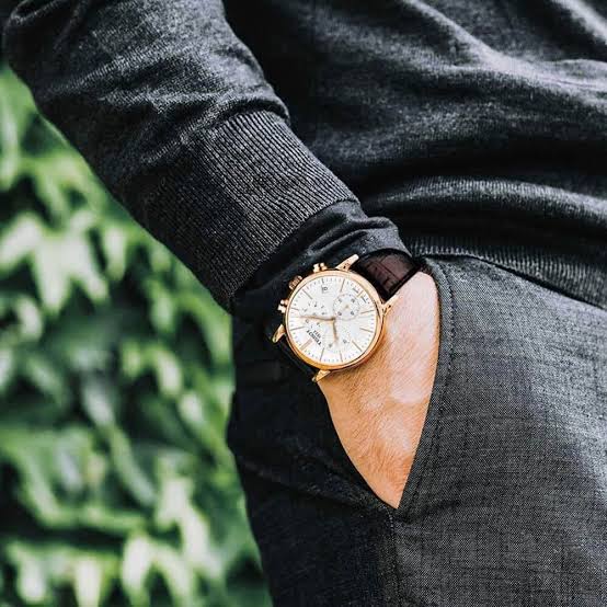 Tissot Carson chronograph worn on wrist with leather strap and rose gold case