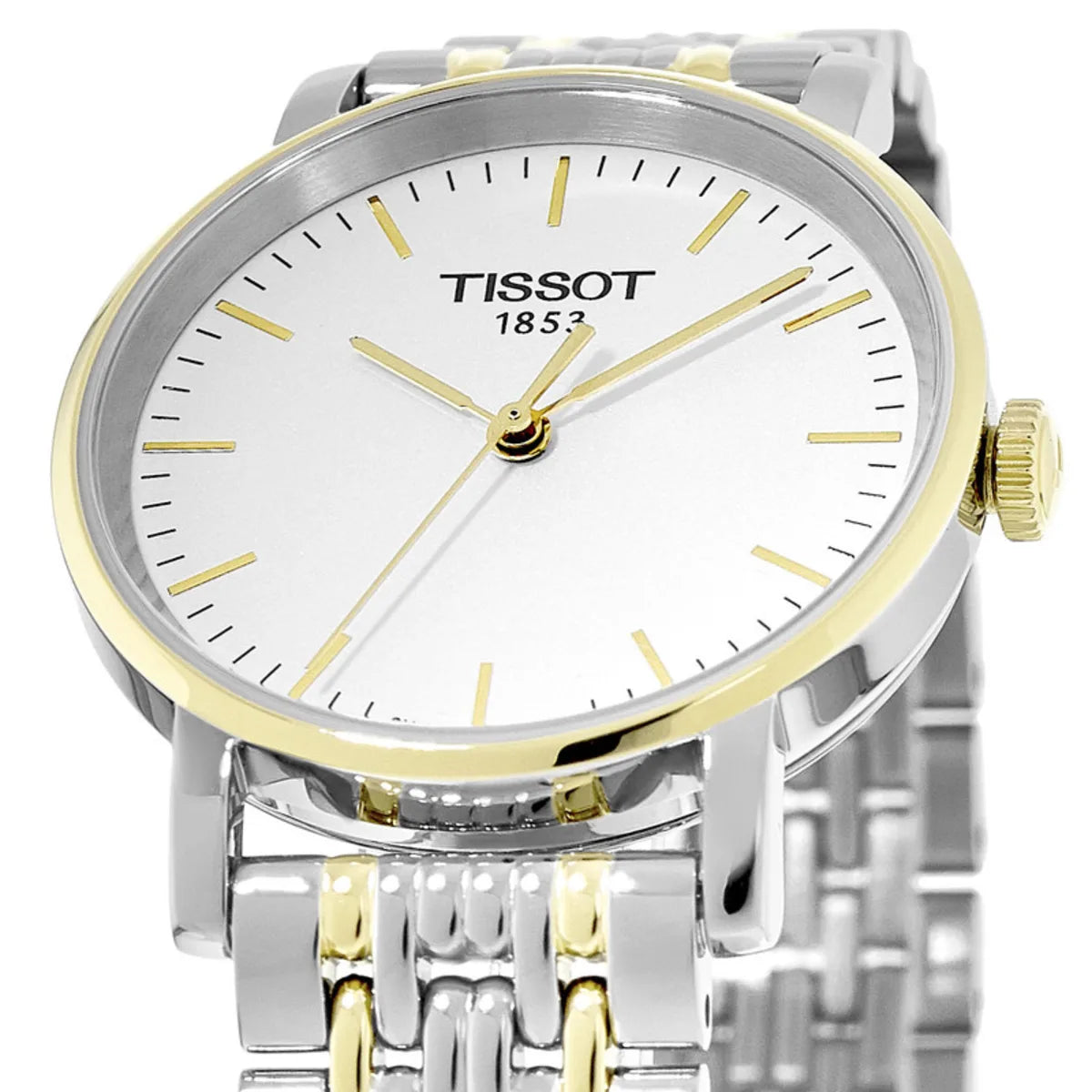 Tissot T-Classic Everytime dial detail showing white face, Arabic indices, and gold hands