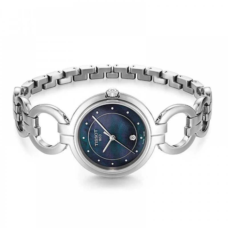 Tissot T-Lady Flamingo watch on wrist, showing linked stainless steel bracelet and round case