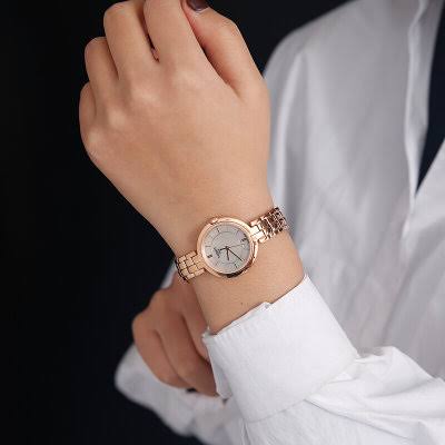 Tissot T-Lady Flamingo rose gold watch worn on wrist