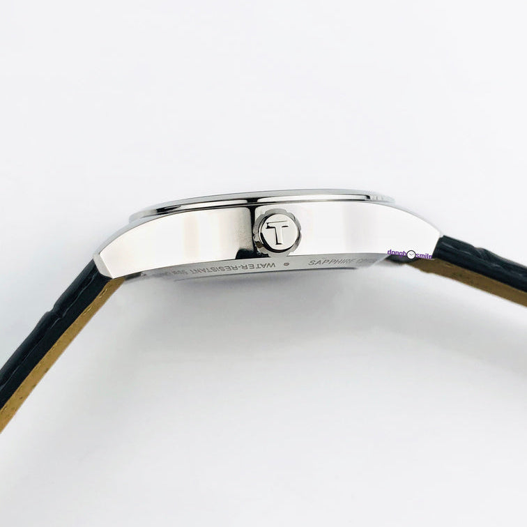 Tissot T One Automatic side profile showing stainless steel case and black leather strap