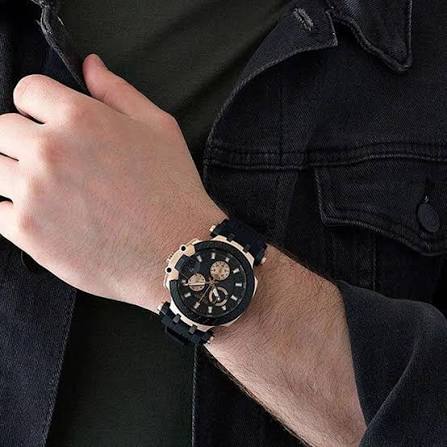 Tissot T-Race chronograph men's watch worn on wrist showing rose gold case and black dial