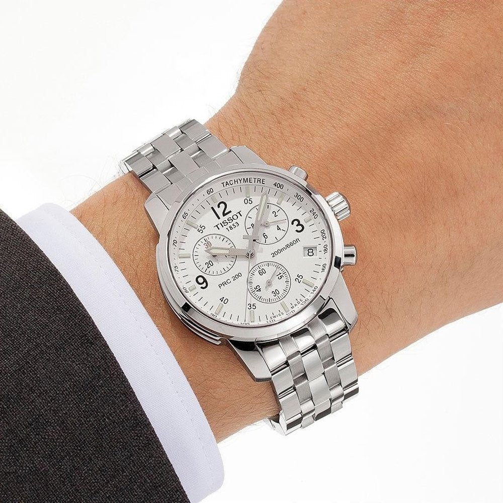 Tissot T-Sport PRC 200 chronograph watch worn on wrist with white dial visible
