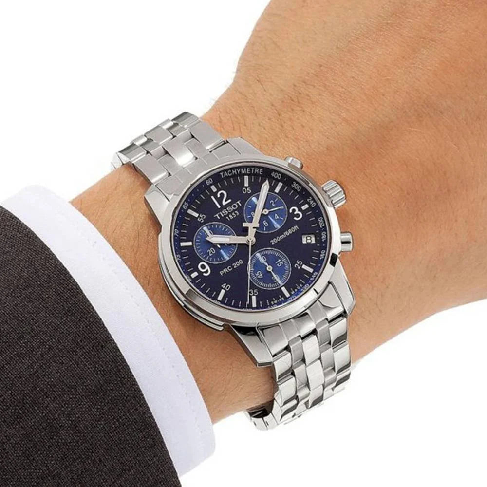 Tissot T-Sport PRC200 chronograph worn on wrist showing stainless steel bracelet