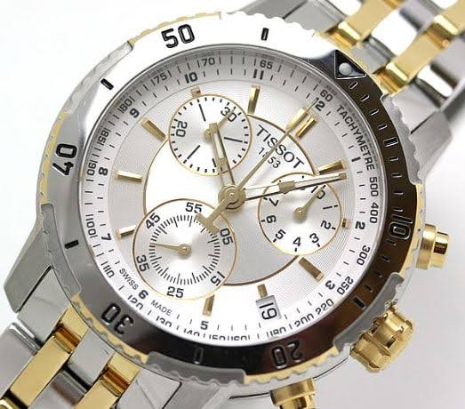 Close-up of Tissot T-Sport dial showing chronograph subdials, hour markers and gold-plated hands