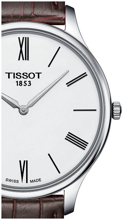 Close-up of white dial with Roman numerals and Tissot 1853 branding on T Classic Tradition watch