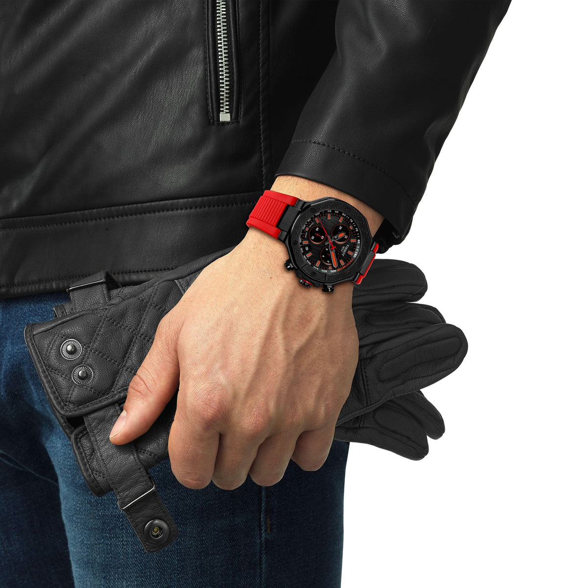 Tissot T-Race chronograph worn on wrist, black dial with orange chronograph hands visible