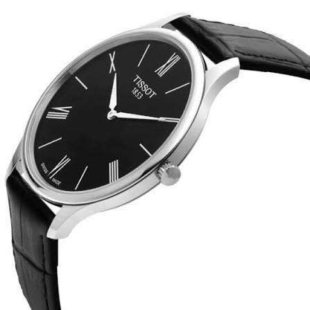 Tissot Tradition 39mm watch displayed at angle showing black dial and case profile