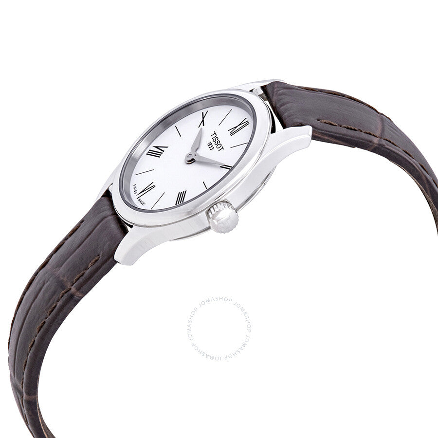 Tissot Tradition 5.5 watch shown at angle on wrist, displaying white dial and brown leather strap