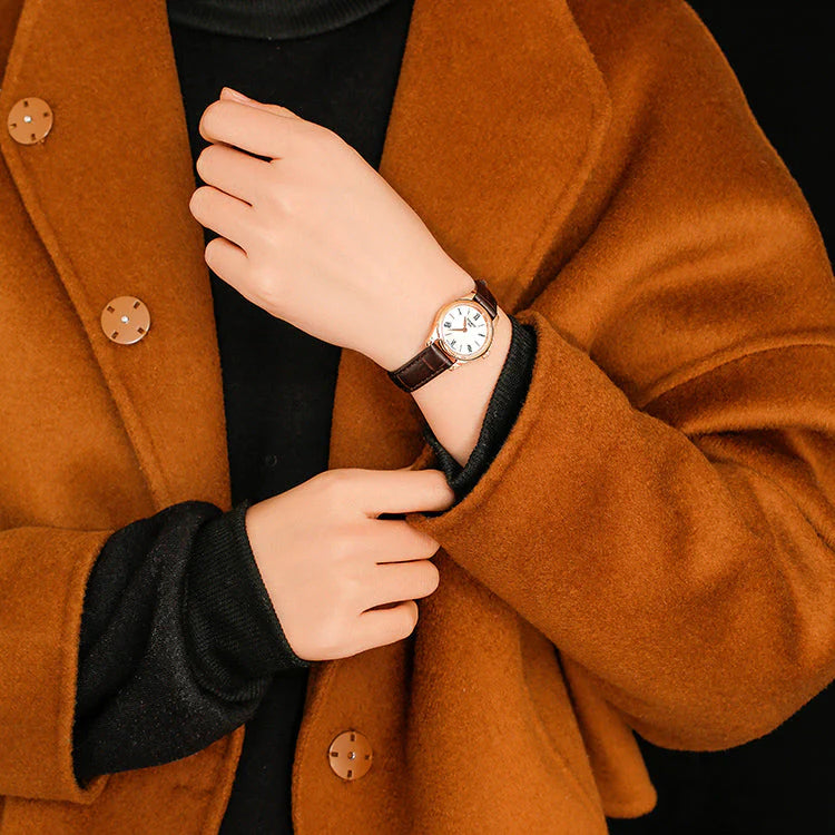 Tissot Tradition watch worn on wrist with white dial and Roman numeral markers