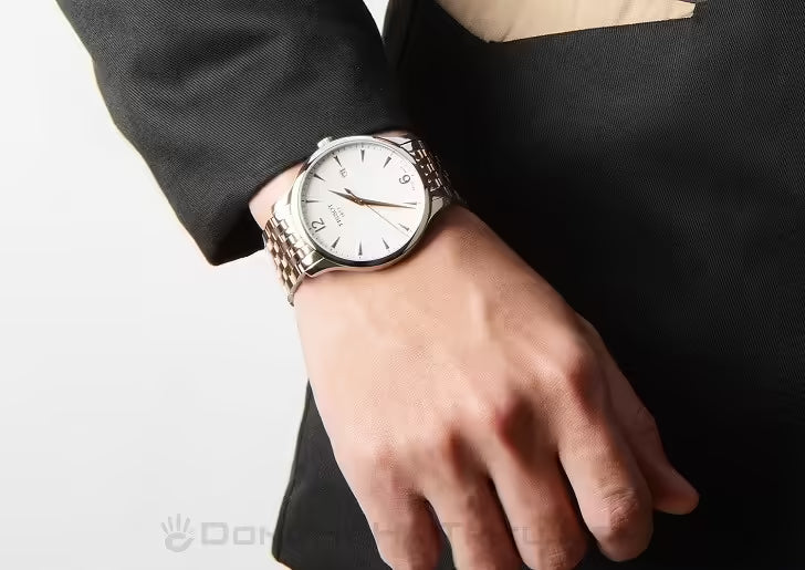 Tissot Tradition watch on-wrist showing silver dial and two-tone stainless steel bracelet