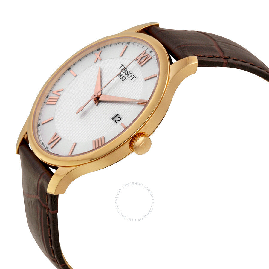 Tissot Tradition watch angled view showing gold case profile, silver dial, and brown crocodile leather strap