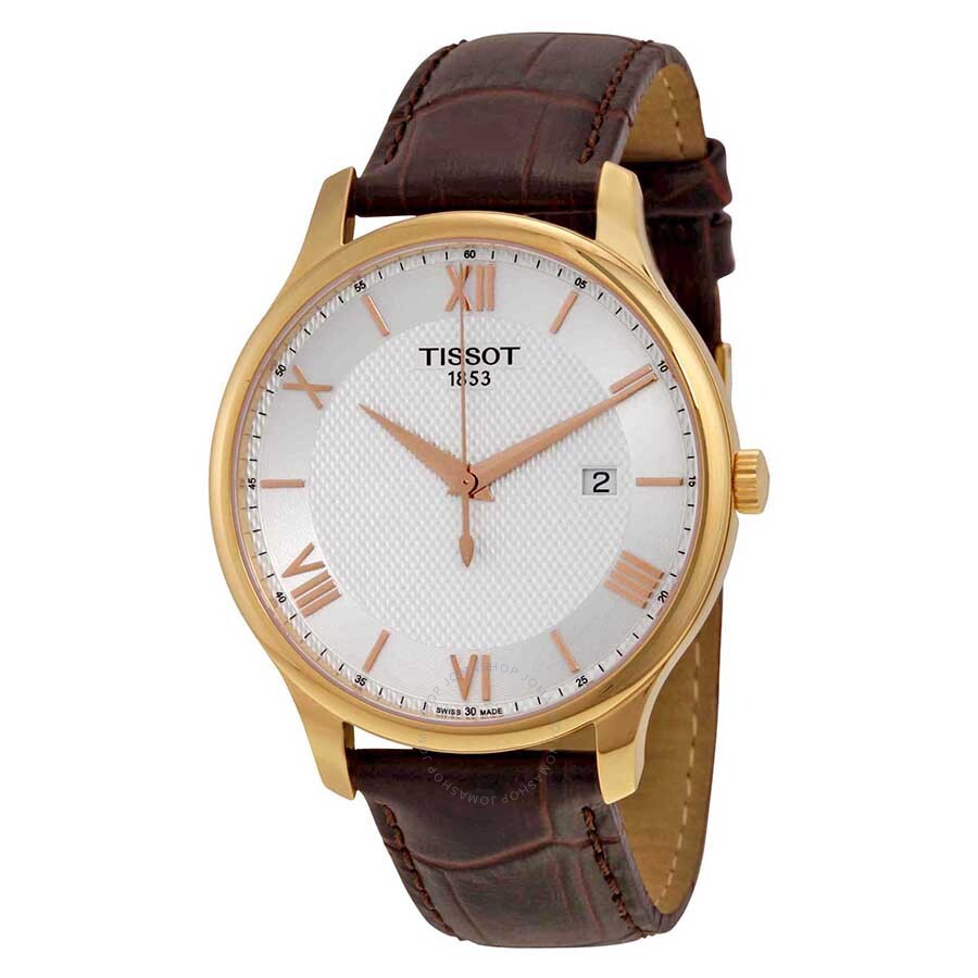Tissot Tradition men's quartz watch with gold case, silver dial, rose gold Roman numerals, and brown leather strap