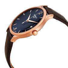 Tissot Tradition watch side view showing rose gold case and leather strap