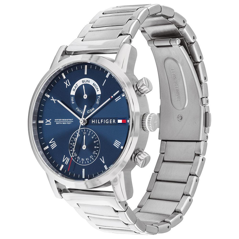 Side angled view of Tommy Hilfiger steel watch showing navy dial and metal bracelet strap