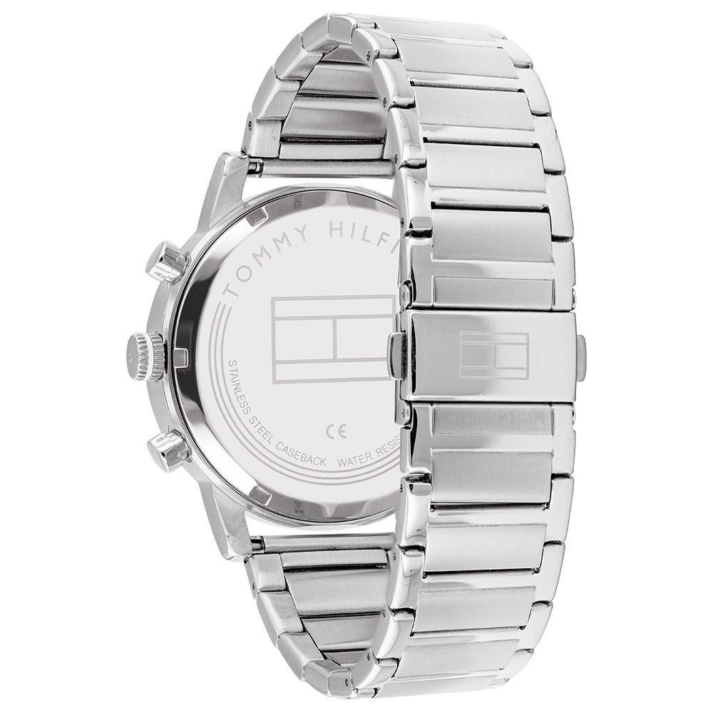 Caseback of Tommy Hilfiger steel watch showing engraved logo and stainless steel bracelet