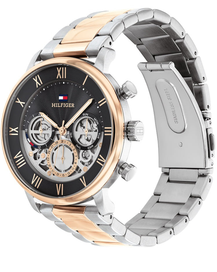Tommy Hilfiger Legend watch angle view showing silver and rose gold two-tone metal bracelet and side profile