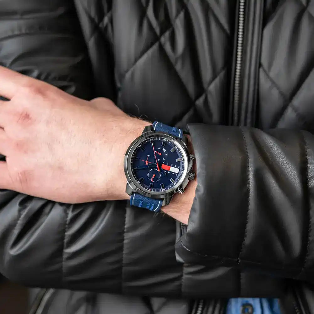 Tommy Hilfiger chronograph watch on wrist showing blue dial and multi-function chronograph display