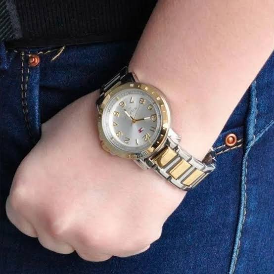 Tommy Hilfiger 1781398 women's watch worn on wrist with two-tone silver and gold bracelet