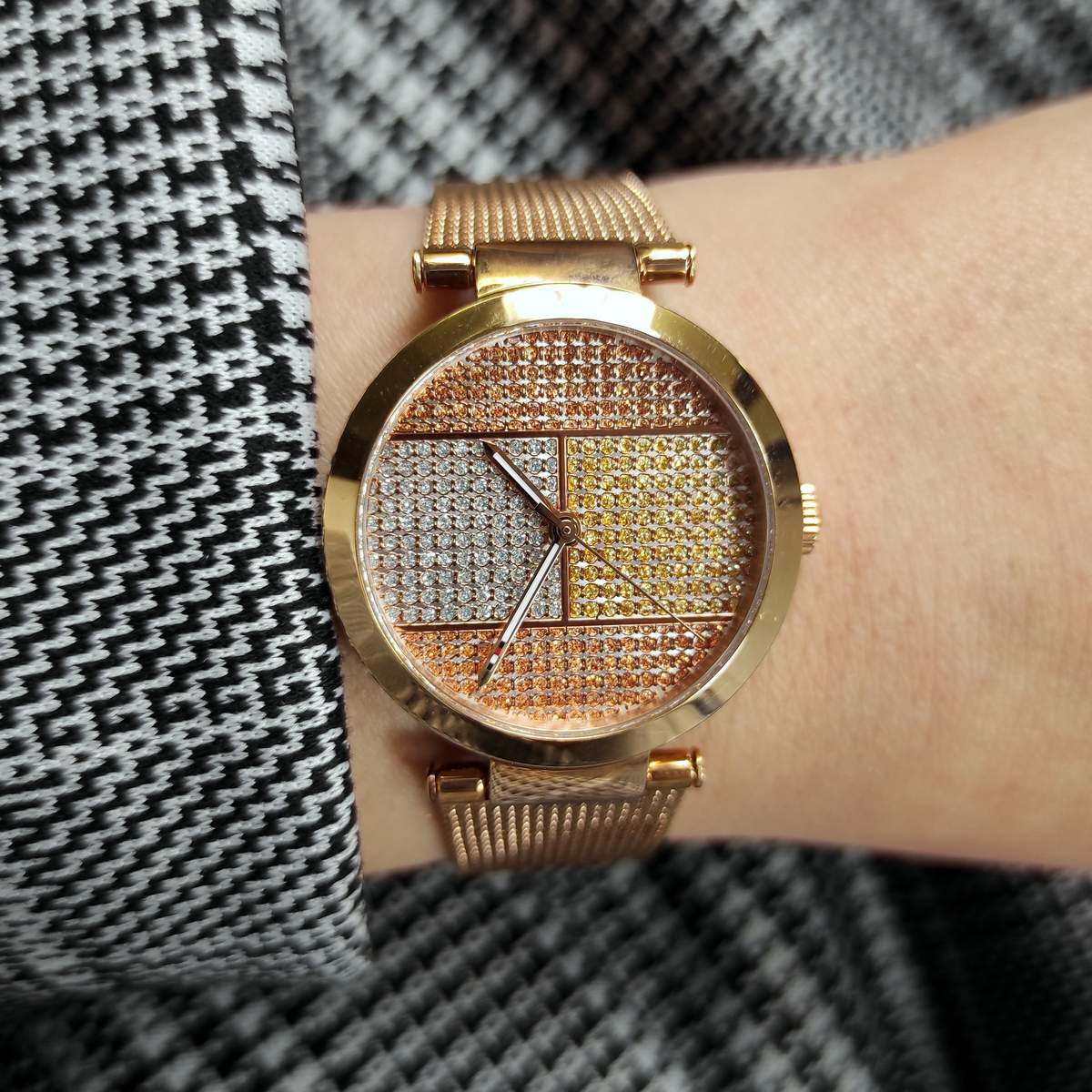 Tommy Hilfiger 1781868 watch worn on wrist, showing rose gold case with crystal-studded dial and mesh bracelet