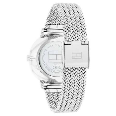 Side view of Tommy Hilfiger watch showing steel mesh bracelet and caseback detail