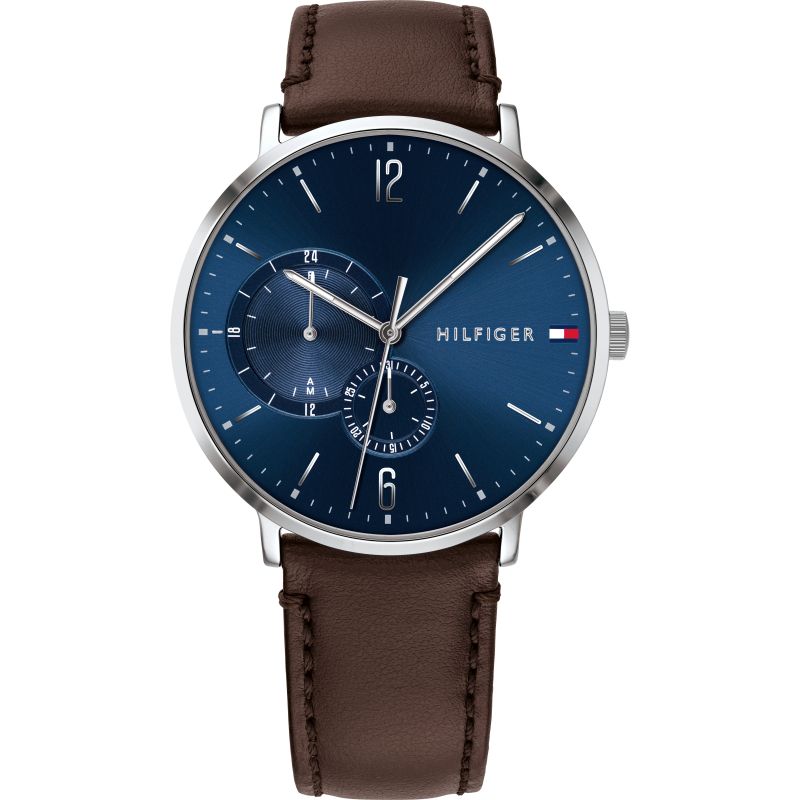 Tommy Hilfiger blue dial watch with silver case, chronograph subdials, and brown leather strap
